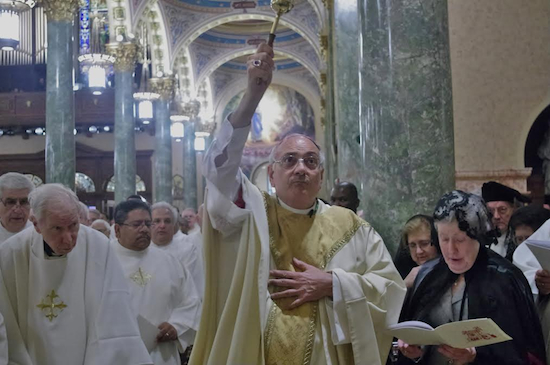Brooklyn Bishop Nicholas DiMarzio will be distributing ashes for Ash Wednesday at the Cathedral Basilica of Saint James in downtown Brooklyn. The bishop is shown celebrating a mass last year. Eagle photo by Francesca Norsen Tate