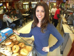 Dina Rosvoglou, a second-generation family member involved in Mike's Donuts, is at the shop shortly after sunrise. Eagle photos by Lore Croghan