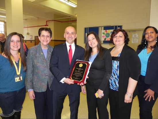 Brotherhood Award winner John Colberg Jr. accepts congratulations from P.S./I.S 104 leaders. Pictured with Colberg are P.T.A. recording Secretary Sophia Koutouzis; Principal Marie DiBella; P.T.A. President Donna Periera-Jahn; P.T.A. Vice President Penny Merron; and P.T.A. Co-Corresponding Secretary Jade LaCroix (left to right). Eagle photo by Paula Katinas