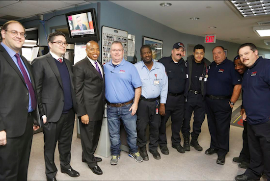 Brooklyn Borough President Eric Adams joins some of the employees of Midwood Ambulance Service at their main dispatch facility and corporate office in Gravesend as he recognizes them as the first honoree of Brooklyn’s Community Businesses, a series he launched to honor local businesses with a commitment to their communities. Photo: Kathryn Kirk/Brooklyn BP’s Office