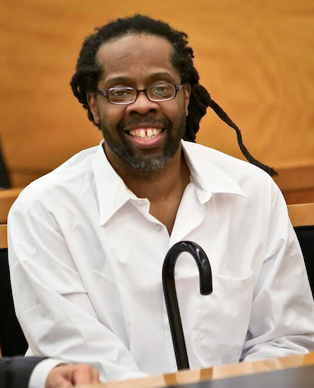 In this 2014 file photo, Robert Hill smiles after arriving to Supreme Court in Brooklyn. Hill and his half-brothers Alvena Jennette and Darryl Austin were exonerated in a decades-old conviction investigated by detective Louis Scarcella. New York City comptroller Scott Stringer agreed to pay $17 million to settle three claims in connection with the brothers who spent a combined 60 years in prison before their convictions were vacated by a judge. AP Photo/Bebeto Matthews, File