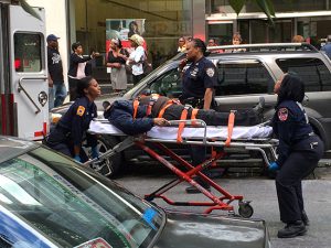 Mayor de Blasio’s budget would add money for additional ambulance tours and dispatchers. Shown - EMTs transporting a patient on Montague Street in Brooklyn Heights. Photo by Samantha Samel