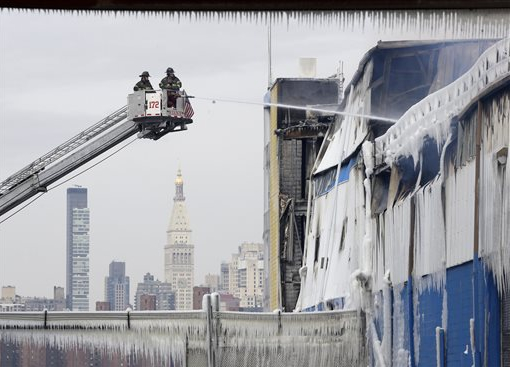 Frigid temps limited firefighters' abilities to put out a Williamsburg fire on Sunday. AP photo/Seth Wenig