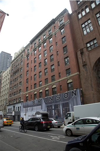 Traffic passes the Branson building on Tuesday in New York. The city is suing the landlords of the Branson building, saying a swath of the apartments were being used as hotel rooms. AP Photo/Bebeto Matthews