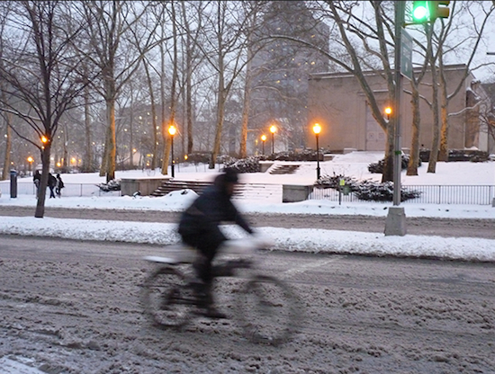A man rides his bike on snowy Cadman Plaza West in Brooklyn Heights. Photo by Mary Frost