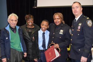 Officer Cornelia Samuels (second from right) was honored with the first Cop of the Month award this year by the 84th Precinct Community Council for her life-saving efforts on Feb. 20. Also pictured (from left): Community Council President Leslie Lewis; Samuel’s partner, Trenett Epps; her nephew Marquese; and Capt. Sergio Centa. Eagle photo by Rob Abruzzese