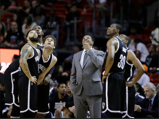 Lionel Hollins and his Nets look up at the scoreboard during Wednesday night’s loss in Miami. Brooklyn is running out of time in its pursuit of a third consecutive playoff berth since arriving in our fair borough. AP Photo