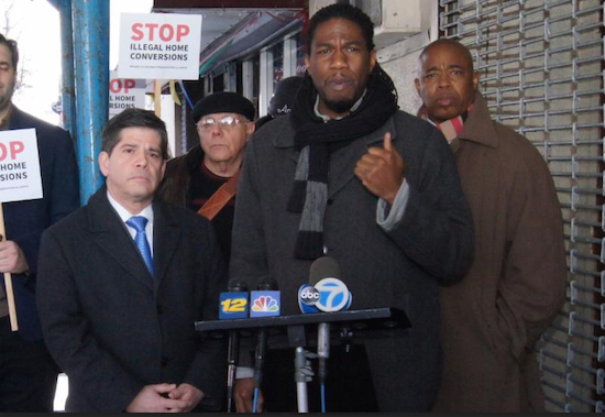 Councilmember Jumaane D. Williams stood with his council colleague Vincent Gentile (left), Brooklyn Borough President Eric Adams (right) and housing advocates in front of an apartment house and church to announce new legislation to combat illegal home conversions. Photo by Ernest Skinner/ NYC Council