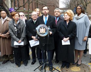 Shown at podium: State Sen. Daniel Squadron upon announcing the bill in December. Other officials, front from left, include BP Eric Adams, U.S. Representative Nydia Velazquez, Comptroller Scott Stringer, Assemblymember Jo Anne Simon, and Public Advocate Letitia James. Photo by Mary Frost