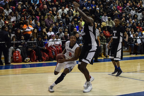 Jefferson’s Shamorie Ponds (in white) drives around 6­-foot-­10 Jessie Govan in a loss to Wings Academy during the PSAL semifinals at Lehman College. Photos by Rob Abruzzese.