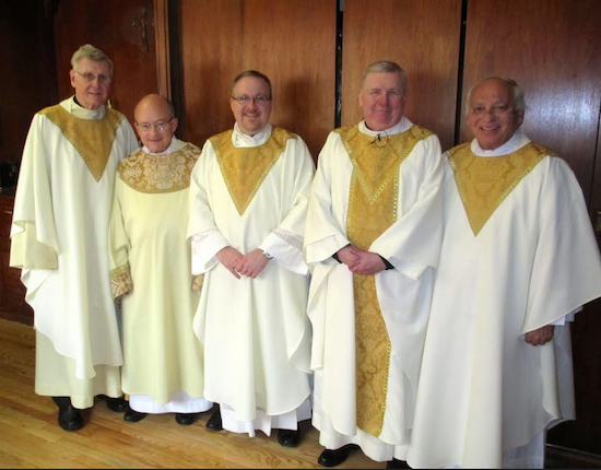The Rev. Msgr. John Maloney (second from right), is joined by fellow clergy members: the Rev. Msgr. Michael Phillips, Deacon Thomas Davis, the Rev. Father Stephen Saffron and the Rev. Martin Kull (left to right) before celebrating his 40th Anniversary mass. Photo courtesy Saint Anselm Catholic Church