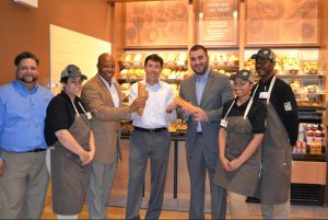 Borough President Eric Adams (third from left) congratulates Panera Bread on the opening of a new bakery-café. Also pictured are Michael Ruiz, general manager of Panera Bread; Isis Cruz, store associate; Greg George, vice president of operations for Doherty Enterprises; Joe Shaia, vice president of Brooklyn Chamber of Commerce; Astrema Franklin, store associate; and Christian Joseph, store associate. Photo courtesy Panera Bread