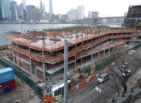 Workers on the roof of the incomplete Pierhouse, at Pier 1 in Brooklyn Bridge Park. Photo by Mary Frost