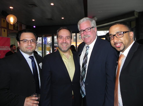 Chamber President Carlo Scissura (second from left) greets lawyer Anthony P. Scali, Merchants of Third Avenue President Bob Howe and Northfield Bank Vice President Brian Chin (left to right) at the cocktail reception. Eagle photos by Paula Katinas