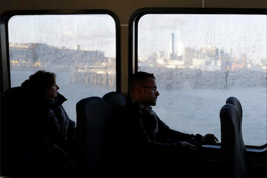 In this Feb. 5 photo, the Manhattan skyline is visible in the background as commuters ride a ferry to Red Hook. New York City Mayor Bill de Blasio has moved a step closer to bring ferry service to some of New York City's waterfront neighborhoods. AP Photo/Mary Altaffer