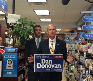 Republican Dan Donovan accepts the endorsement of Robert Engstrom (right), senior vice president of the U.S. Chamber of Commerce, during a recent event at a Staten Island pharmacy. Photo courtesy Donovan campaign