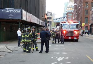 Ladder Company 118 responded on Tuesday to a report of gas venting from a grate in front of 51 Jay St. in DUMBO. FDNY has responded to the leak nine times over the past year. Photo by Mary Frost