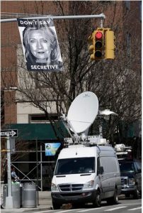 An unknown artist placed a poster on a traffic signal in front of the building where Hillary Rodham Clinton's presidential campaign offices are located on Sunday in Brooklyn. A top adviser to Clinton announced her much-awaited second campaign for the White House on Sunday in an email to alumni of her first presidential campaign. AP Photo/Mark Lennihan