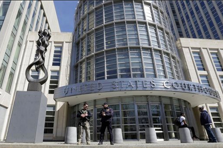 Heavily armed U.S. Marshals stand guard outside federal court April 2, in Brooklyn. A fourth person was arrested in Brooklyn on Monday, accused of supporting ISIS. AP Photo/Mary Altaffer