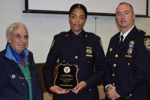 Officer Lauren Jones (center) was presented with the Cop of the Month award by Leslie Lewis (left), 84th Precinct Community Council president, and 84th Precinct Capt. Sergio Centa (right) during Tuesday’s monthly Community Council meeting. Eagle photo by Rob Abruzzese