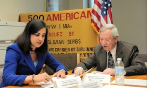 Assemblymembers Nicole Malliotakis and Peter Abbate review the proposed legislation for military veterans following a recent meeting of the Committee on Government Employees. Photo courtesy Malliotakis’s office
