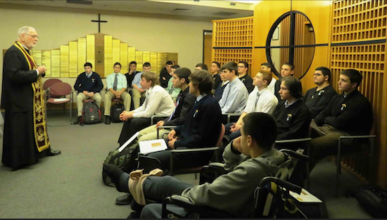 The Very Rev. Eugene N. Pappas leads a recent prayer and study session for students. Photo courtesy Xaverian High School