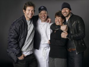 Mark, Paul, Alma and Donnie Wahlberg (left to right) are preparing to open one of their popular burger restaurants in Coney Island. Photo by Zach Dilgard