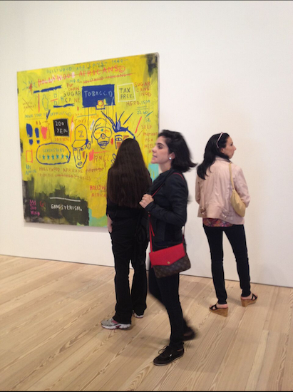 Visitors to the Whitney's new museum in the Meatpacking District check out Basquiat's painting “Hollywood Africans.”