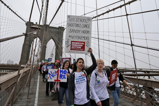 Demonstrators march over the Brooklyn Bridge during the third annual Brooklyn Bridge march and rally to end gun violence on Saturday. AP Photo/Mary Altaffer