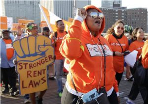 Protestors march across the Brooklyn Bridge at to call on the state legislature to strengthen rent laws this year on Thursday. AP Photo/Frank Franklin II
