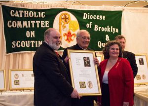 Left to right: Honoree Michael Connors, Esq., Bishop DiMarzio, Beth Connors, and Paul Stanton (in rear). Eagle Photo by Francesca Norsen Tate