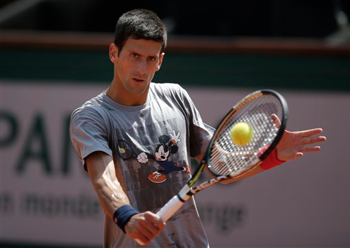 Serbia's Novak Djokovic returns the ball during a training session for the French Tennis Open at the Roland Garros stadium, on Friday in Paris. The French Open starts Sunday. AP Photo/Francois Mori
