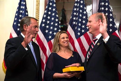 House Speaker John Boehner swears in Dan Donovan on Tuesday. AP Photo/Brett Carlsen
