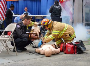 Teams of Emergency Medical Technicians and Paramedics rushed to rescue mock victims at MetroTech in Downtown Brooklyn on Thursday as the New York City Fire Department hosted its 15th annual FDNY EMS Competition and health fair. Photo by Mary Frost