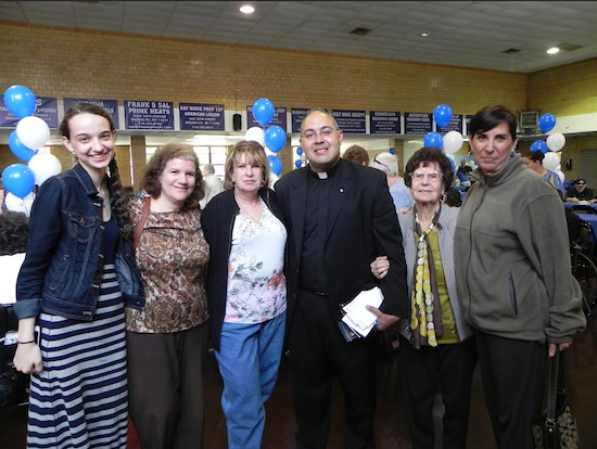 At a reception held after the mass, the Rev. Michael Louis Gelfant is greeted by parishioners and friends Isabella Biesty, Madeline Oddo, Marjorie Klimuk, Salvatrice Schillaci and Maria Biesty (left to right). Eagle photo by Paula Katinas