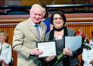 Teresa McPhail accepts a Woman of Distinction Award from state Sen. Marty Golden in Albany. Photo courtesy Golden’s office
