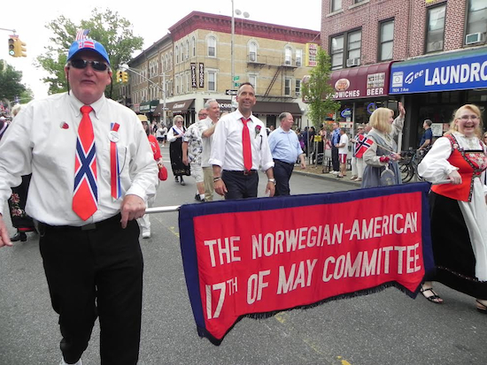 The parade committee marches up Third Avenue proudly displaying their banner. Eagle photos by Paula Katinas