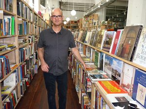 Yuval Gans, the owner of P.S. Bookshop. Photo by Mary Frost