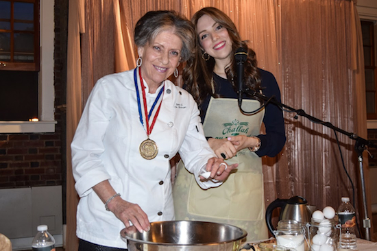 Sara Briman (l.), an international challah award-winner, and Chaya Hecht demonstrated for nearly 300 Jewish women how to make challah bread during Challah On The Park in Prospect Park on Thursday night. Eagle photos by Rob Abruzzese