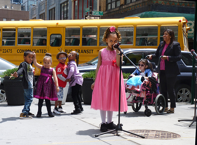 Autistic and disabled students from District 75’s P53K school in Brooklyn performed at Borough President Eric Adams’ School Lunchtime Concert Series on Wednesday. Singing was Tiffany, who received enthusiastic applause from the lunchtime crowd. Photo by Mary Frost