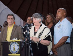 Rabbi Ellen Lippmann of Congregation Kolot Chayeinu invites people to start dialogues with each other. Standing with her in foreground are: noted civil rights activist Norman Siegel and Brooklyn Borough President Eric Adams. In background are Rev. David Cousins of Bridge Street A.M.E. Church, City Councilmember Jumaane Williams and Public Advocate Letitia James. Eagle photo by Francesca Norsen Tate
