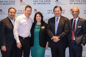 The New York Marriott at the Brooklyn Bridge threw a party to celebrate the completion of phase one of its $43 million renovation on Wednesday. From left: Brooklyn Chamber of Commerce President Carlo Scissura, Jason Muss, Chamber Chairman Denise Arbesu, Joshua Muss and the Marriott branch’s General Manager Sam Ibrahim. Eagle photos by Rob Abruzzese