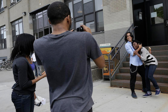Roshana Paul, left, Dexter Dugar Jr., second from left, Justin Casquejo, second from right, and Tayana Brumaire make a short film in New York. This summer, thousands of young people will go to camp, attend prestigious academic programs and even study filmmaking in Paris thanks to online crowdfunding sites like Kickstarter and Indiegogo. AP Photo/Mary Altaffer
