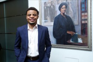 Christopher D. Wilds, pictured at Columbia Law School in front of a portrait of Constance Baker Motley, a 1946 Columbia Law School graduate who worked at the NAACP LDF (including on the Brown v. Board of Education case) before becoming the nation's first female black federal judge. Photo courtesy of Columbia Law School