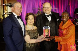Joseph J. Lhota (third from left) accepts his award from Dr. Robert Grossman, dean and CEO of NYU Langone Medical Center; Wendy Z. Goldstein, president and CEO of NYU Lutheran; and Emma Graeber Porter, chairperson of the NYU Lutheran Board of Trustees (left to right). Photo courtesy NYU Lutheran