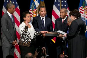 Attorney General Loretta Lynch, second from left, next to President Barack Obama, participates in a formal investiture ceremony, Wednesday at the Warner Theatre in Washington. From left are, the president, the attorney general, her husband Stephen Hargrove, father Lorenzo Lynch, mother Lorine Lynch, and Supreme Court Justice Sonia Sotomayor. AP Photo/Jacquelyn Martin