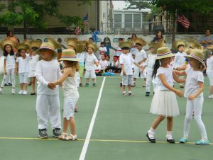 Students wore charming straw hats to perform one of the dances. Photo courtesy Stefanie Meola