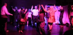 Members of the audience come on stage to dance with Aurelia Baumgartner. Photo courtesy of St. Francis College