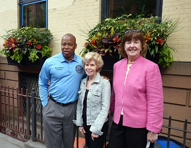 Borough President Eric Adams with incoming Garden Club President Sally Webb and outgoing President Donna Ganson, right.
