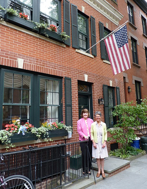 Jill Gilbert, right, stands in front of her double-decker window box display at 27 Garden Place with Donna Ganson.